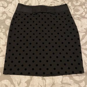 Black polkadot pencil skirt with bow detail